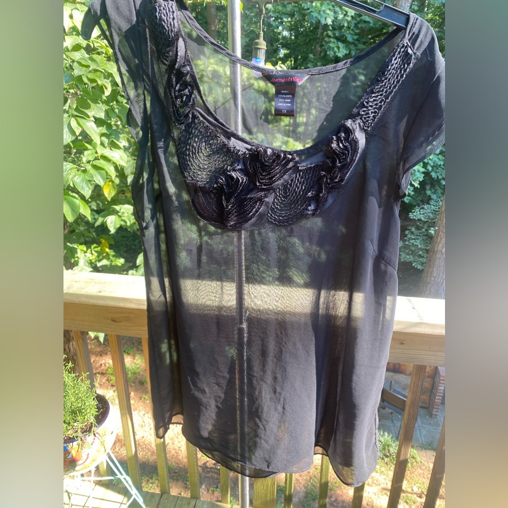 Sheer black blouse.